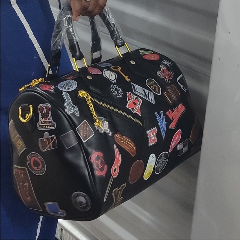 Stylish Black Satchel with Patchwork Design - image 1